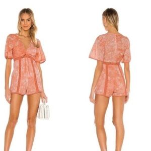 Tularosa Monroe eyelet romper in a coral/orange tie-dye XS